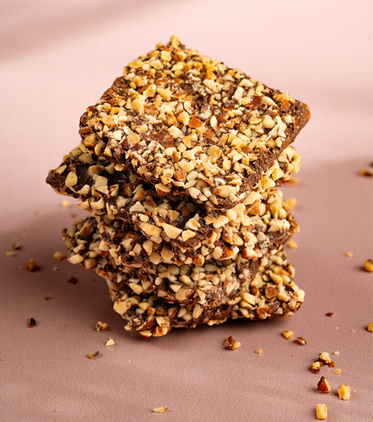 Premium Belgian dark chocolate almond praline with roasted almonds and salted caramel by Farmaan